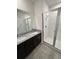 Bathroom features double vanity, tile flooring and glass shower at 11634 Woodleaf Dr, Bradenton, FL 34211