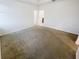 Spacious carpeted main bedroom featuring neutral tones, ideal for relaxation at 11634 Woodleaf Dr, Bradenton, FL 34211