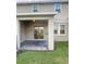 Cozy covered back patio with neutral tones, providing a perfect outdoor space for relaxation and entertaining at 11634 Woodleaf Dr, Bradenton, FL 34211