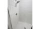 Modern white tiled shower, offering a clean and minimalist design at 11634 Woodleaf Dr, Bradenton, FL 34211