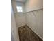 Walk-in closet with carpet flooring, wire shelving and a window at 11634 Woodleaf Dr, Bradenton, FL 34211