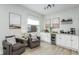 Bright, modern bar with white cabinets, granite counters, a beverage cooler, and stylish decor at 11837 Derbyshire Dr, Tampa, FL 33626