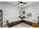 This bedroom offers neutral walls, hardwood floors, and bright windows at 11837 Derbyshire Dr, Tampa, FL 33626