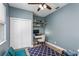 Bright bedroom features a closet, desk, and hardwood floors at 11837 Derbyshire Dr, Tampa, FL 33626