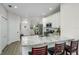 Bright kitchen boasts granite countertops, modern stainless appliances and an island with breakfast bar seating at 11837 Derbyshire Dr, Tampa, FL 33626