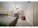 Bedroom featuring neutral walls, carpet flooring, a ceiling fan, and window at 1310 Rustlewood Dr, Brandon, FL 33510