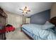 Bedroom with blue accent wall, neutral walls, carpet flooring, and closet at 1310 Rustlewood Dr, Brandon, FL 33510