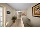 Hallway featuring artwork and a staircase at 1310 Rustlewood Dr, Brandon, FL 33510