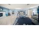 Cozy living room with fireplace, nautical rug, light blue walls and neutral furniture at 1310 Rustlewood Dr, Brandon, FL 33510