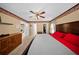 Bright main bedroom featuring neutral walls, a ceiling fan and an ensuite bathroom at 1310 Rustlewood Dr, Brandon, FL 33510