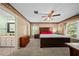 Spacious main bedroom with en-suite bathroom, carpeted floors, and ample natural light at 1310 Rustlewood Dr, Brandon, FL 33510