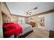 Spacious main bedroom featuring a ceiling fan, neutral walls and an ensuite at 1310 Rustlewood Dr, Brandon, FL 33510