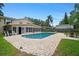 Inviting backyard pool with an outdoor seating area and beautiful patio, perfect for entertaining and relaxation at 1310 Rustlewood Dr, Brandon, FL 33510