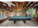 Recreation room featuring a pool table, unique decor, and access to the yard at 1310 Rustlewood Dr, Brandon, FL 33510