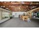 Large rec room with exposed wood ceiling, bar, seating, and lots of light at 1310 Rustlewood Dr, Brandon, FL 33510