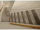 Carpeted stairway provides a smooth and quiet transition between floors with the help of a wooden railing at 1310 Rustlewood Dr, Brandon, FL 33510
