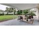 Covered back patio featuring outdoor seating and a view of the backyard at 13344 88Th Ave, Seminole, FL 33776