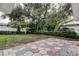 Spacious backyard featuring a patio area and mature trees at 13344 88Th Ave, Seminole, FL 33776
