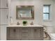 Bathroom featuring double sink vanity, large mirror, and natural light at 13344 88Th Ave, Seminole, FL 33776