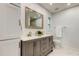 Bathroom featuring double sink vanity, large mirror, and natural light at 13344 88Th Ave, Seminole, FL 33776