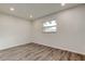Well-lit bedroom with luxury vinyl plank floors and a window at 13344 88Th Ave, Seminole, FL 33776