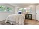 Bright bedroom with ample natural light, plush rug, and stylish decor elements at 13344 88Th Ave, Seminole, FL 33776