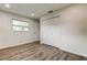 Bedroom with vinyl wood floors, a window, and closet with folding doors at 13344 88Th Ave, Seminole, FL 33776