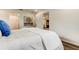 Bright, well-lit bedroom featuring a comfortable bed and an ensuite bathroom at 13344 88Th Ave, Seminole, FL 33776