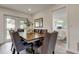 Stylish dining room with large table, seating for six, and a glimpse of the bedroom at 13344 88Th Ave, Seminole, FL 33776