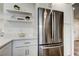 Bright kitchen features white cabinetry, stainless steel appliances, and quartz countertops at 13344 88Th Ave, Seminole, FL 33776