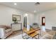 Well-lit living room flows into kitchen area with modern furnishings at 13344 88Th Ave, Seminole, FL 33776