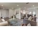 Well-lit living area with view into the kitchen and dining area, creating an open feel at 13344 88Th Ave, Seminole, FL 33776