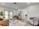 Open-concept living area with comfortable seating, modern decor, and easy access to the backyard at 13344 88Th Ave, Seminole, FL 33776