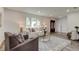 Bright living room with plush sofas, area rug, and a view of the front door at 13344 88Th Ave, Seminole, FL 33776