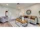 Inviting living room with neutral tones, stylish furnishings, and seamless flow to other rooms at 13344 88Th Ave, Seminole, FL 33776
