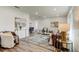 Spacious living room with stylish decor, flowing into dining area and a view of the bedroom at 13344 88Th Ave, Seminole, FL 33776