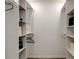 Spacious walk-in closet with built-in shelving and ample storage space at 13344 88Th Ave, Seminole, FL 33776