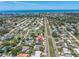 Aerial view of the property and surrounding neighborhood with a view of the water at 14060 102Nd Ave, Largo, FL 33774