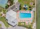 An aerial view of the community pool with recreational facilities including a playground, tennis and shuffleboard courts at 14060 102Nd Ave, Largo, FL 33774