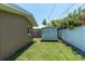 Backyard featuring storage shed, privacy fence, and well-kept lawn at 14060 102Nd Ave, Largo, FL 33774