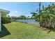 Well-maintained backyard with lush lawn and white fence at 14060 102Nd Ave, Largo, FL 33774
