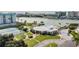 Community clubhouse featuring a pool, tennis courts, and waterfront views at 14060 102Nd Ave, Largo, FL 33774