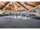 Spacious event room with a high wooden ceiling, dance floor, stage, views, and waterfront scenery at 14060 102Nd Ave, Largo, FL 33774