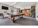 Spacious game room featuring a pool table, cozy seating, and stylish decor elements at 14060 102Nd Ave, Largo, FL 33774