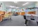 Bright game room features an air hockey table, ping pong table, foosball table, and seating at 14060 102Nd Ave, Largo, FL 33774