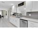 Well-appointed kitchen with white cabinetry, stainless steel appliances, and gray subway tile backsplash at 14060 102Nd Ave, Largo, FL 33774