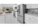Spacious kitchen with stainless steel appliances, white cabinets, and an open layout to living areas at 14060 102Nd Ave, Largo, FL 33774