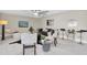 Cozy living room with tile flooring, comfortable seating, stylish decor, and a ceiling fan at 14060 102Nd Ave, Largo, FL 33774