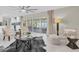 Bright living room with modern furnishings, stylish decor, and sliding doors to a screened porch at 14060 102Nd Ave, Largo, FL 33774