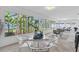 This sunroom features a tile floor and seating at 14060 102Nd Ave, Largo, FL 33774